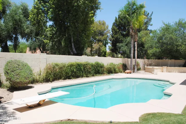 a view of a living room and floor to ceiling window