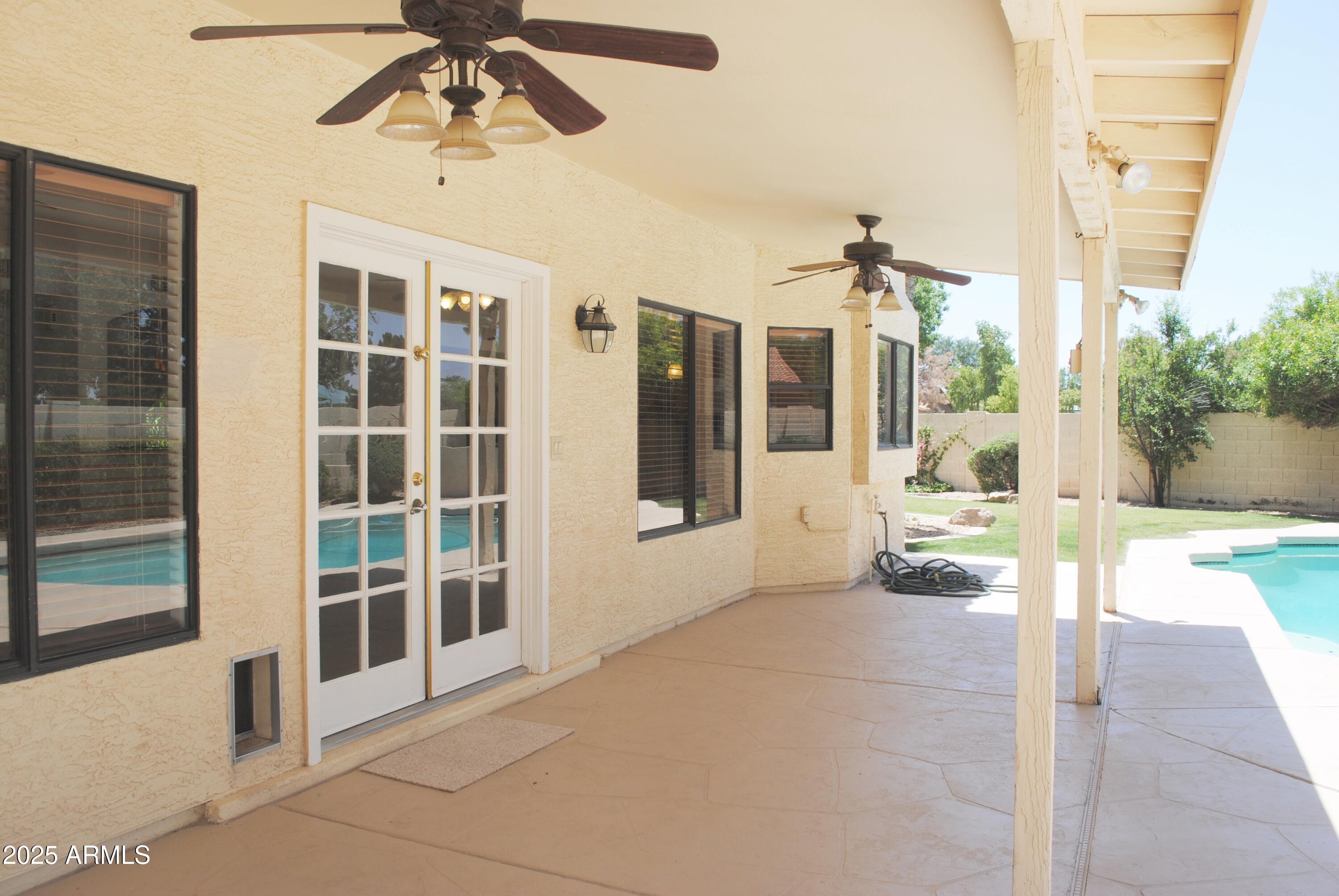 9276 South Myrtle Avenue Tempe, AZ 85284 - Photo 29 of 52 a view of an entryway with a floor to ceiling windows and a room