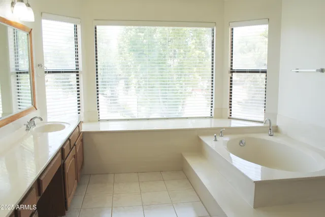 a bathroom with a shower and a glass door