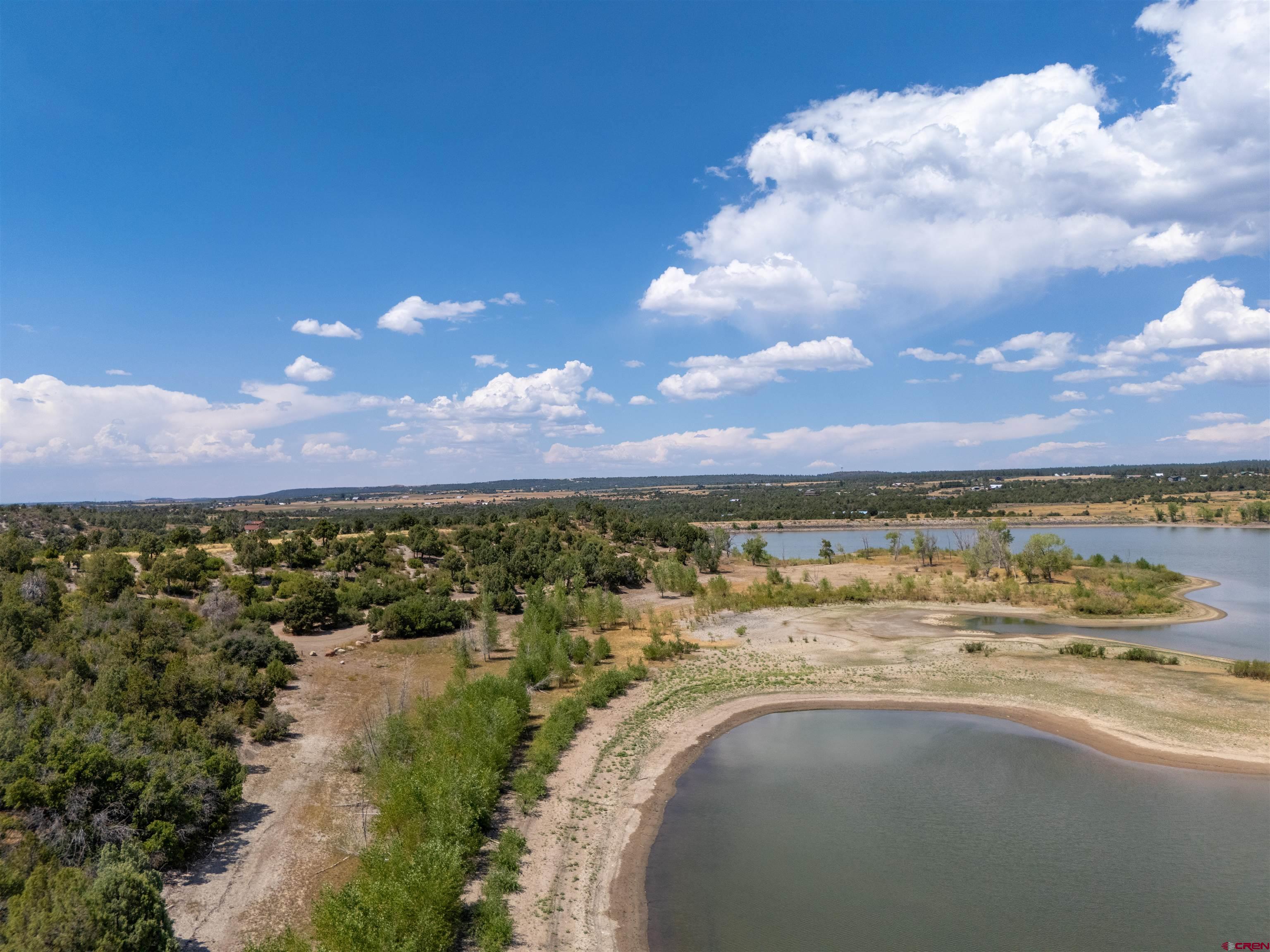 Lot 9 Road P2 Loop Mancos, CO 81328 - Photo 6 of 34 a view of a lake with houses in the back