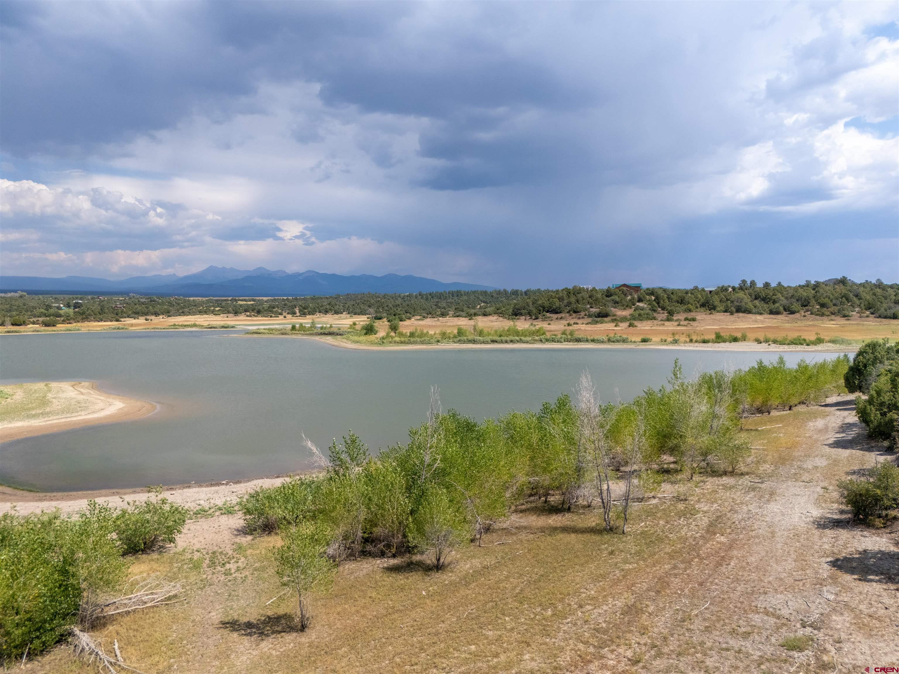Lot 9 Road P2 Loop Mancos, CO 81328 - Photo 9 of 34 a view of a lake with houses in the back
