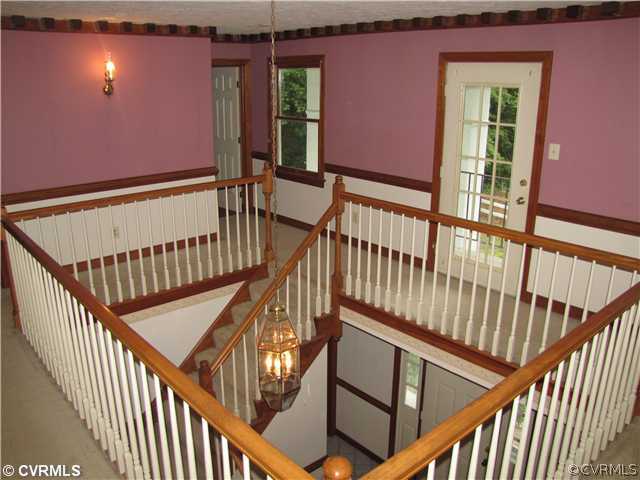 5097 Dabneys Mill Road Manquin, VA 23106 - Photo 2 of 15 Foyer - Grand staircase wraps around foyer. Note t