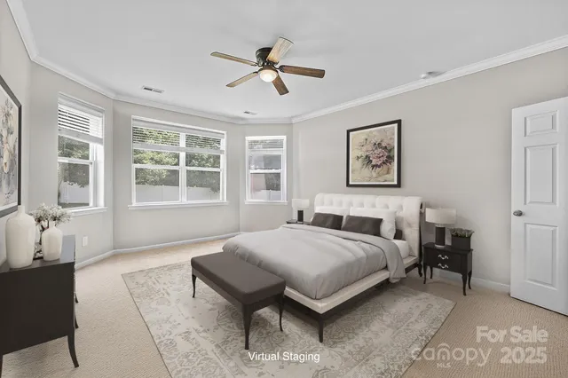 a spacious bedroom with a bed and wooden floor