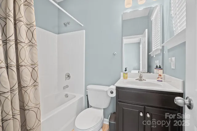 a bathroom with a sink a toilet and bathtub
