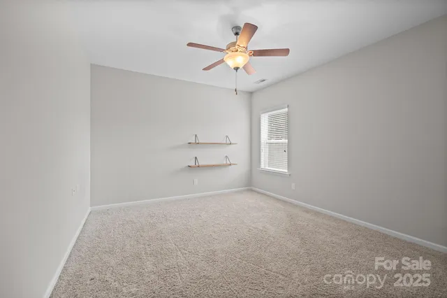 a view of a livingroom with a ceiling fan