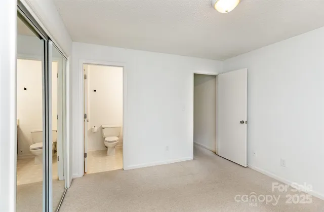 a view of a bathroom with a glass door and shower