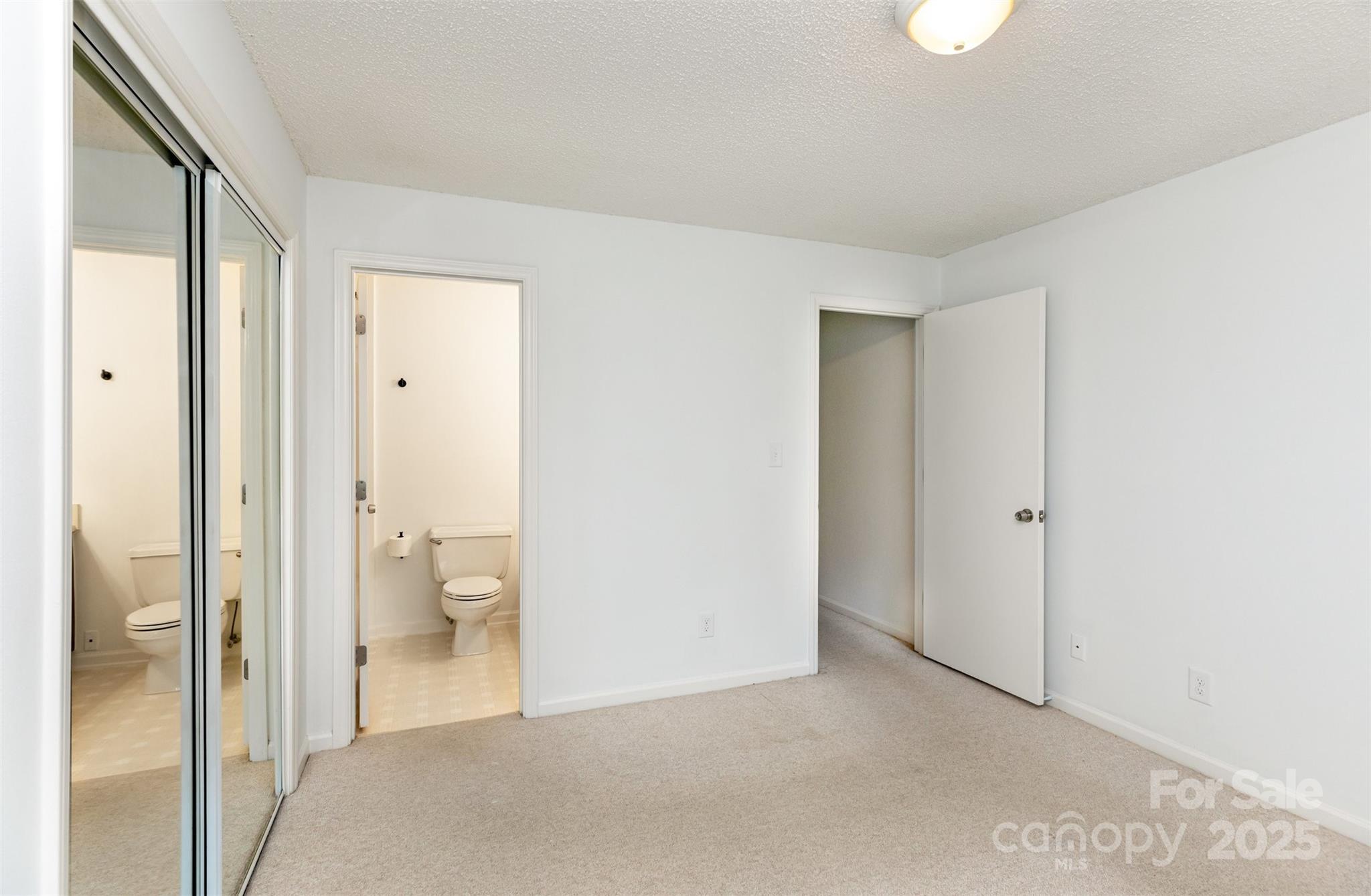 1021 Churchill Downs Court, Unit G Charlotte, NC 28211 - Photo 13 of 37 a view of a bathroom with a glass door and shower