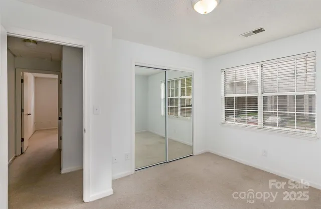 a view of empty room with windows