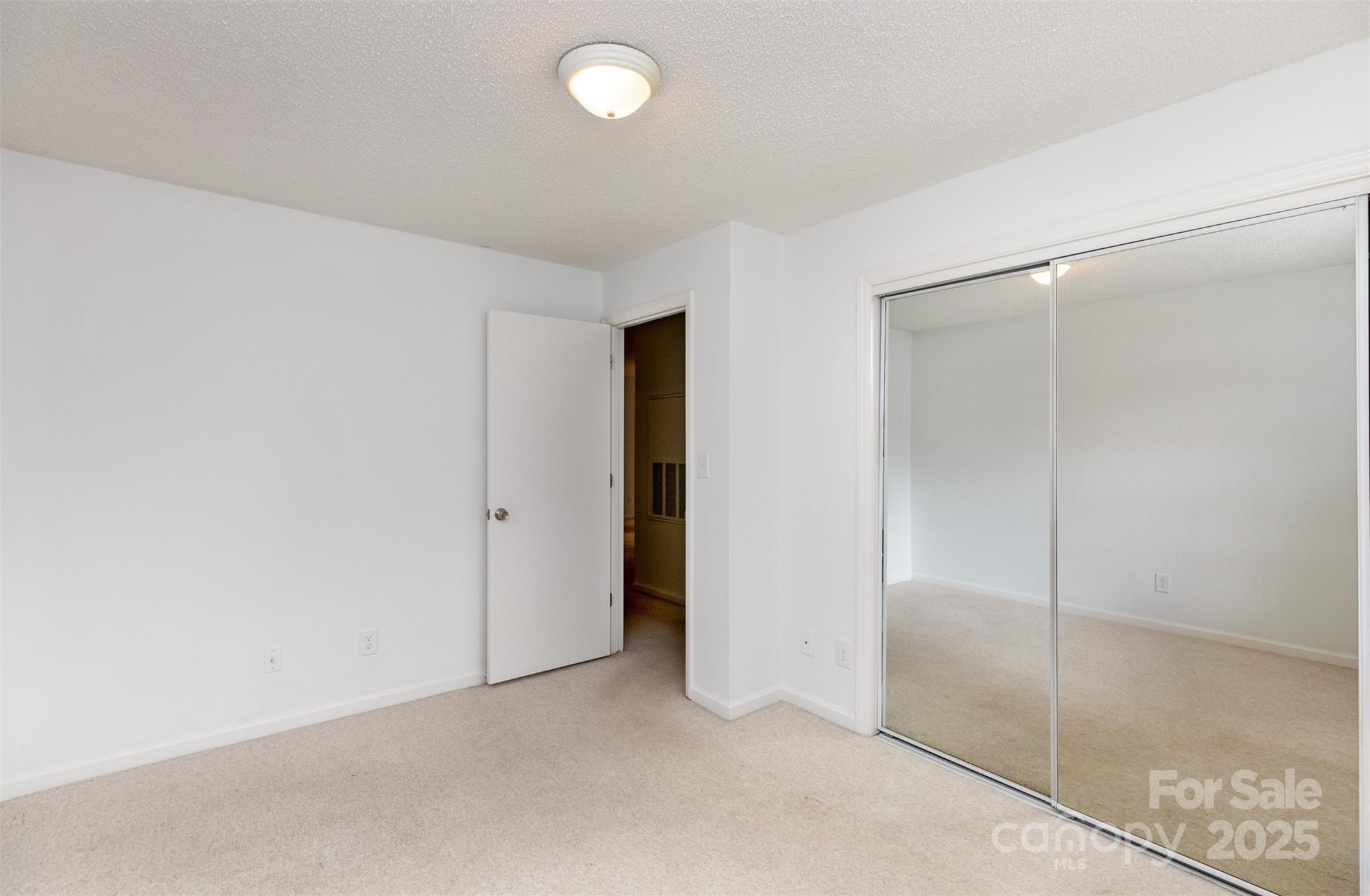 1021 Churchill Downs Court, Unit G Charlotte, NC 28211 - Photo 20 of 37 a view of an empty room