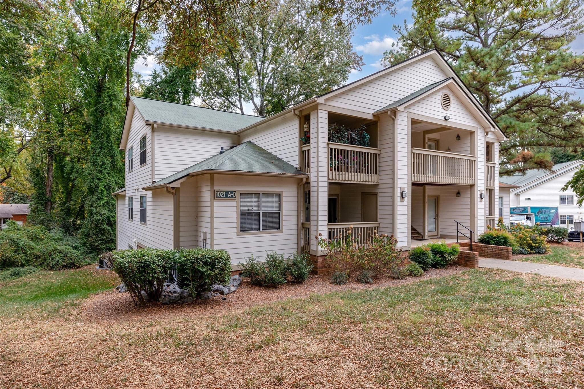1021 Churchill Downs Court, Unit G Charlotte, NC 28211 - Photo 2 of 37 a front view of a house with garden