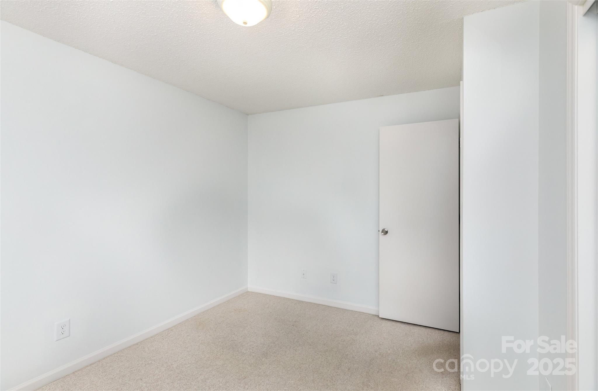 1021 Churchill Downs Court, Unit G Charlotte, NC 28211 - Photo 21 of 37 a view of an empty room