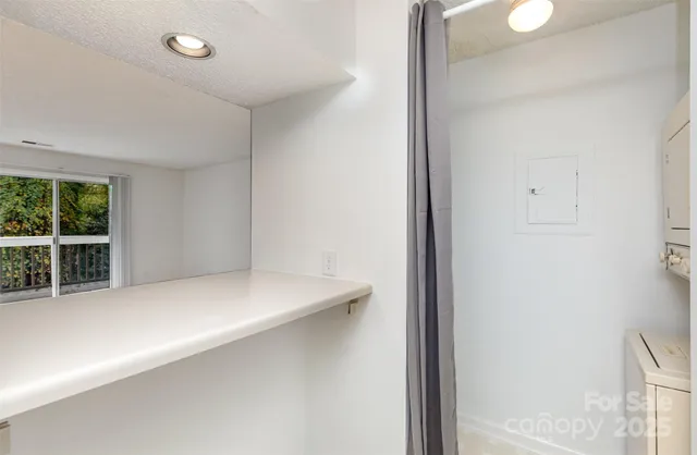 a view of an empty room with a window