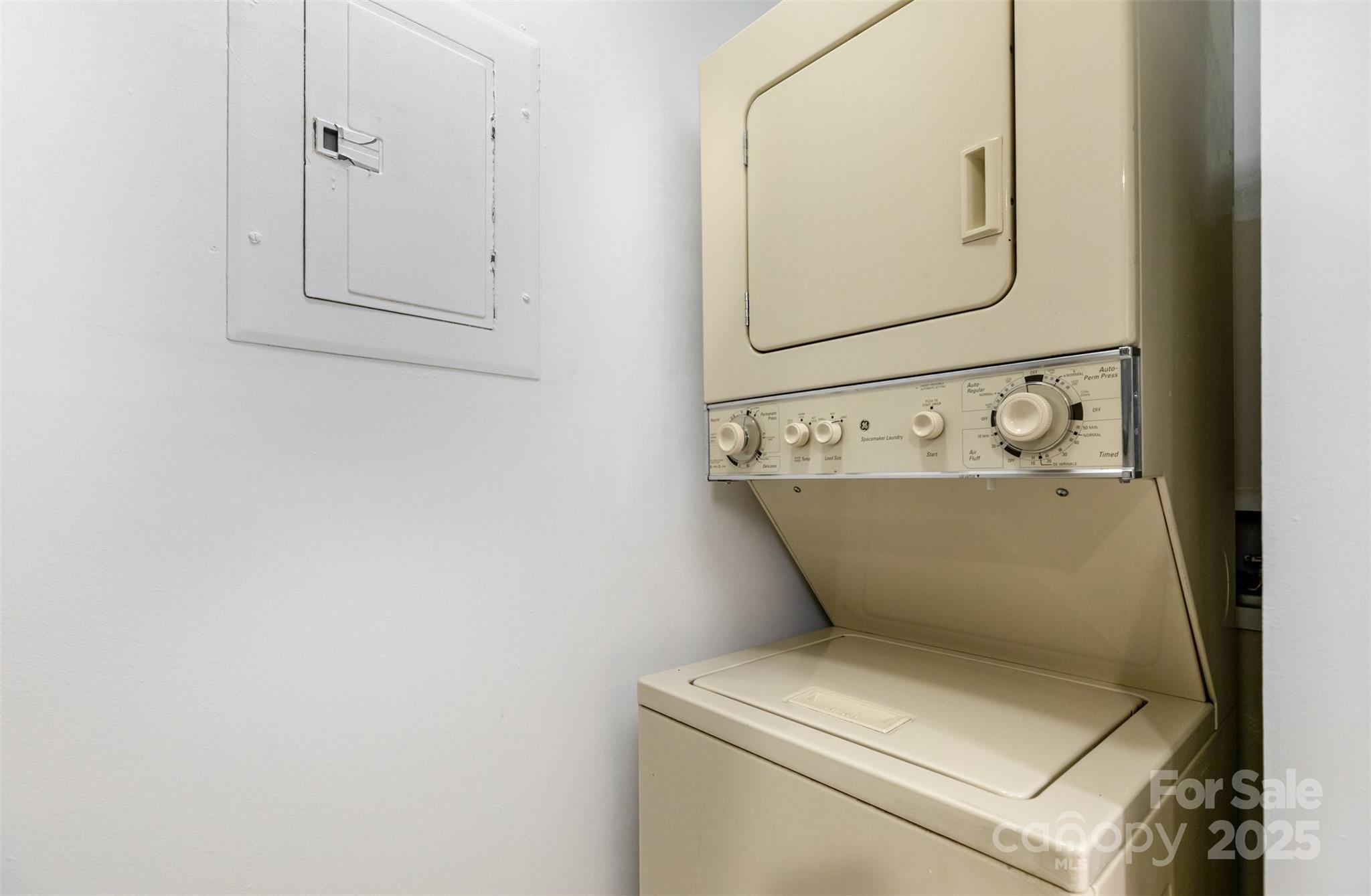 1021 Churchill Downs Court, Unit G Charlotte, NC 28211 - Photo 25 of 37 a utility room with dryer and white walls