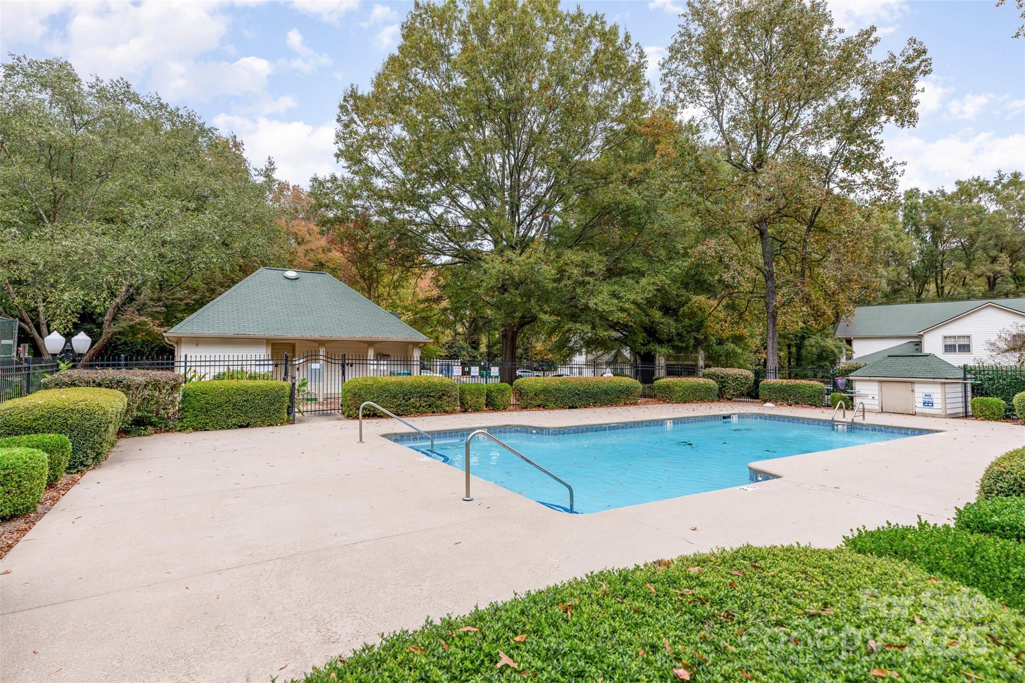 1021 Churchill Downs Court, Unit G Charlotte, NC 28211 - Photo 31 of 37 a view of a house with swimming pool and sitting area