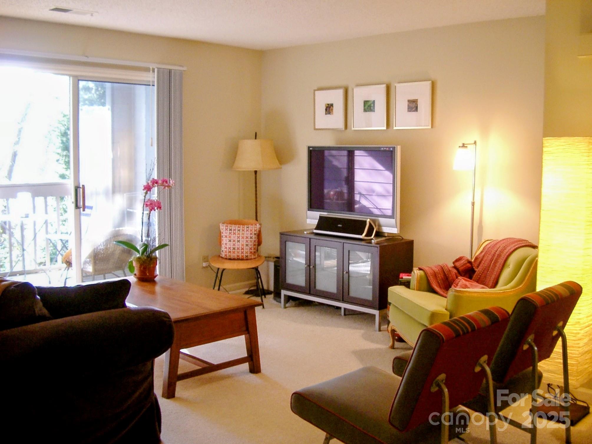1021 Churchill Downs Court, Unit G Charlotte, NC 28211 - Photo 35 of 37 a living room with furniture kitchen view and a window