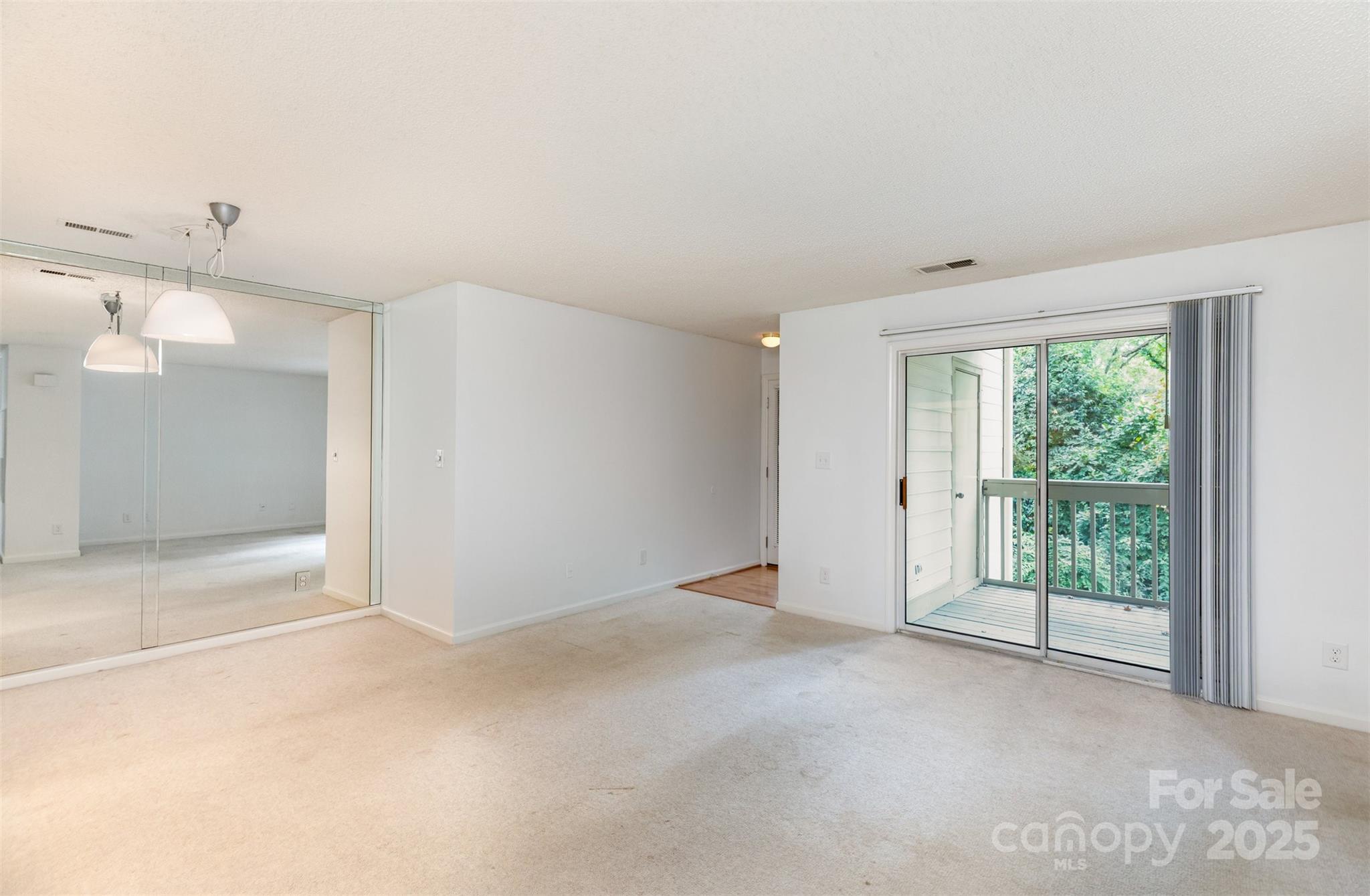 1021 Churchill Downs Court, Unit G Charlotte, NC 28211 - Photo 5 of 37 a view of an empty room with a window