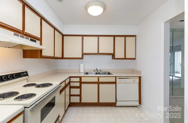 a kitchen with stainless steel appliances granite countertop a stove and a sink