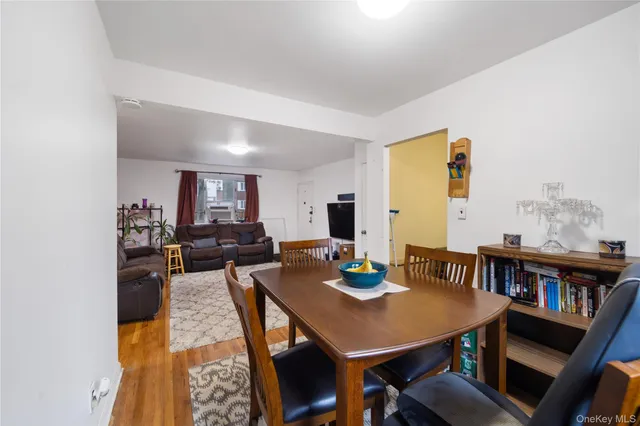 a view of a dining room with furniture and a table