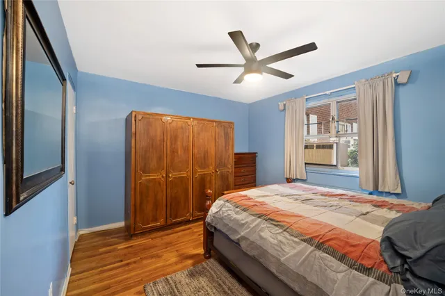 a bedroom with a large bed and a large window