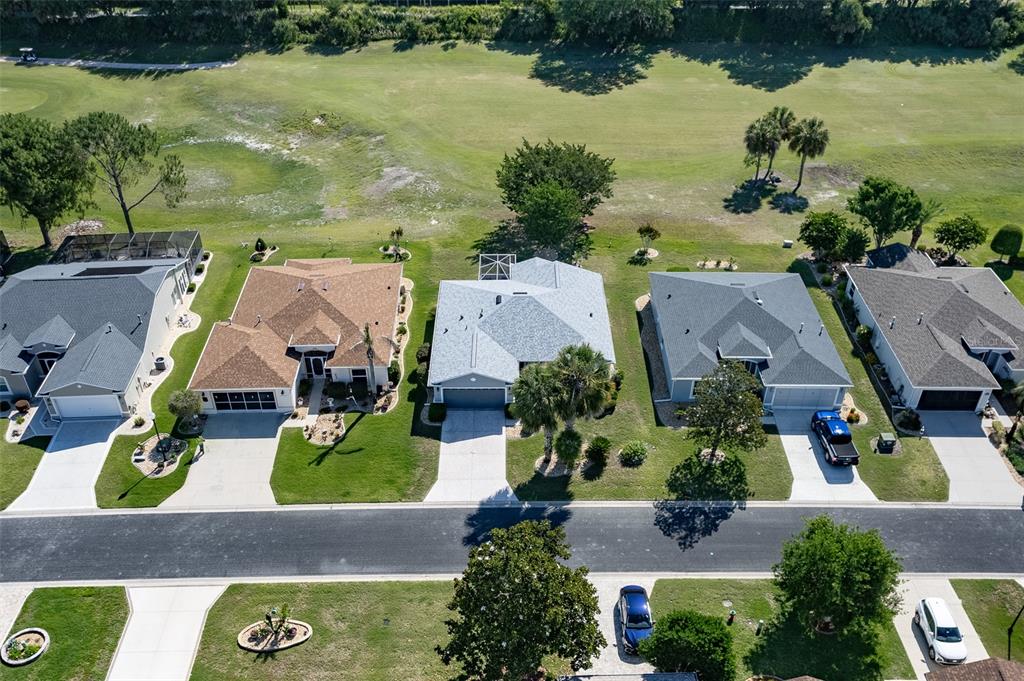 15143 Southwest 14th Avenue Road Ocala, FL 34473 - Photo 44 of 53 an aerial view of house with yard swimming pool and outdoor seating
