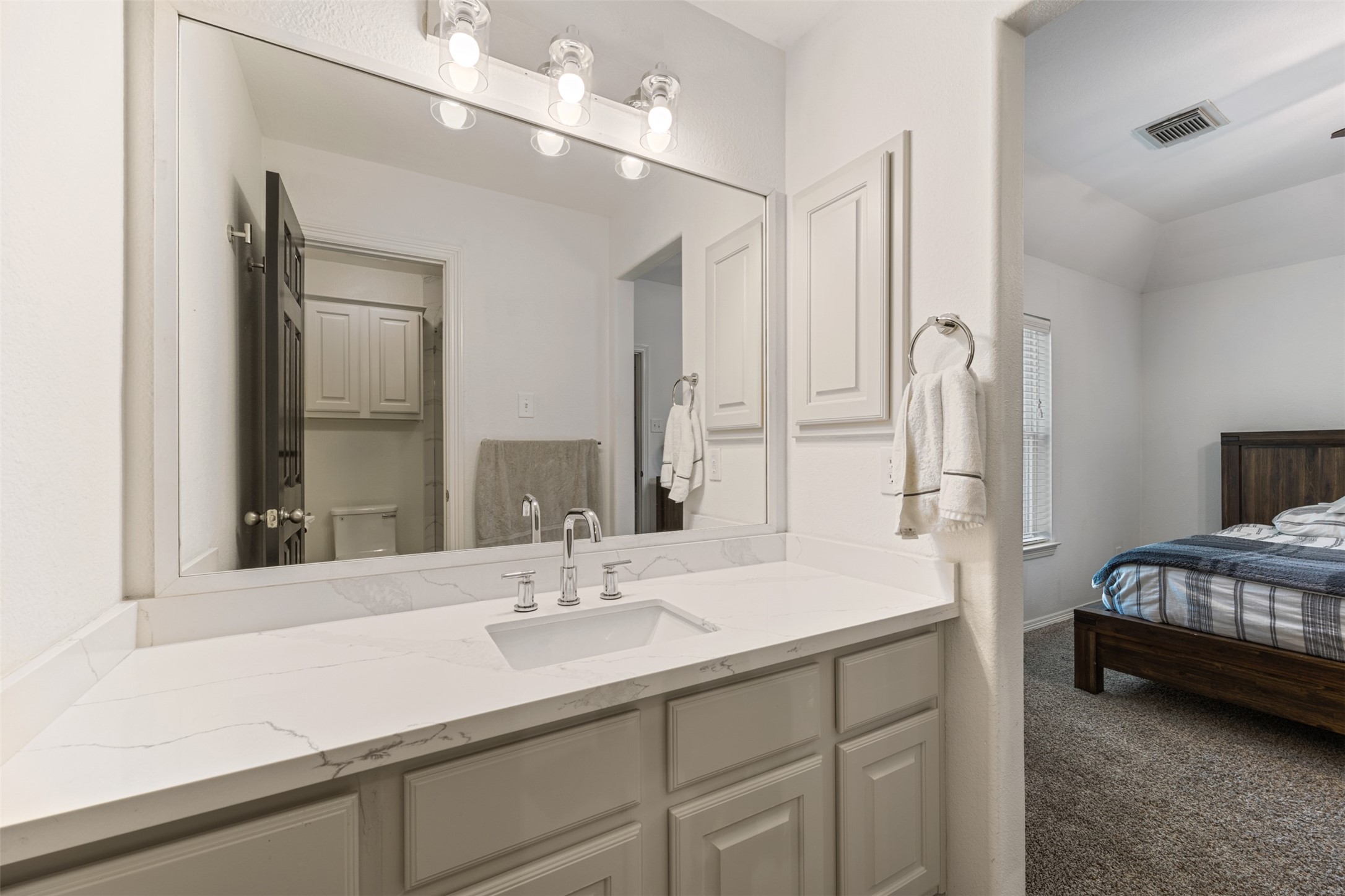 58 South Longsford Circle Spring, TX 77382 - Photo 22 of 50 a en suite bathroom with a sink double vanity and a mirror