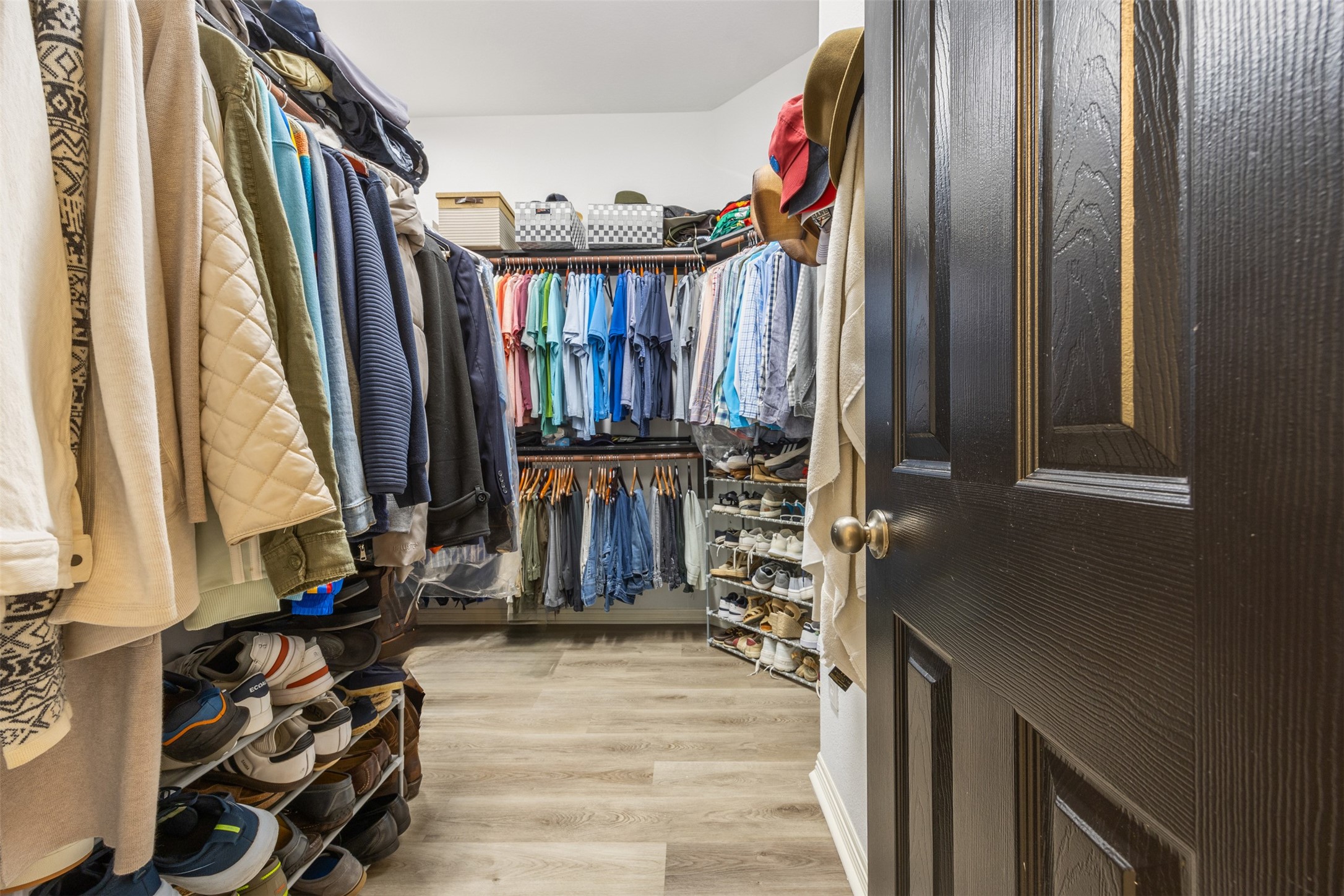 58 South Longsford Circle Spring, TX 77382 - Photo 34 of 50 a view of walk in closet with clothes and shoes