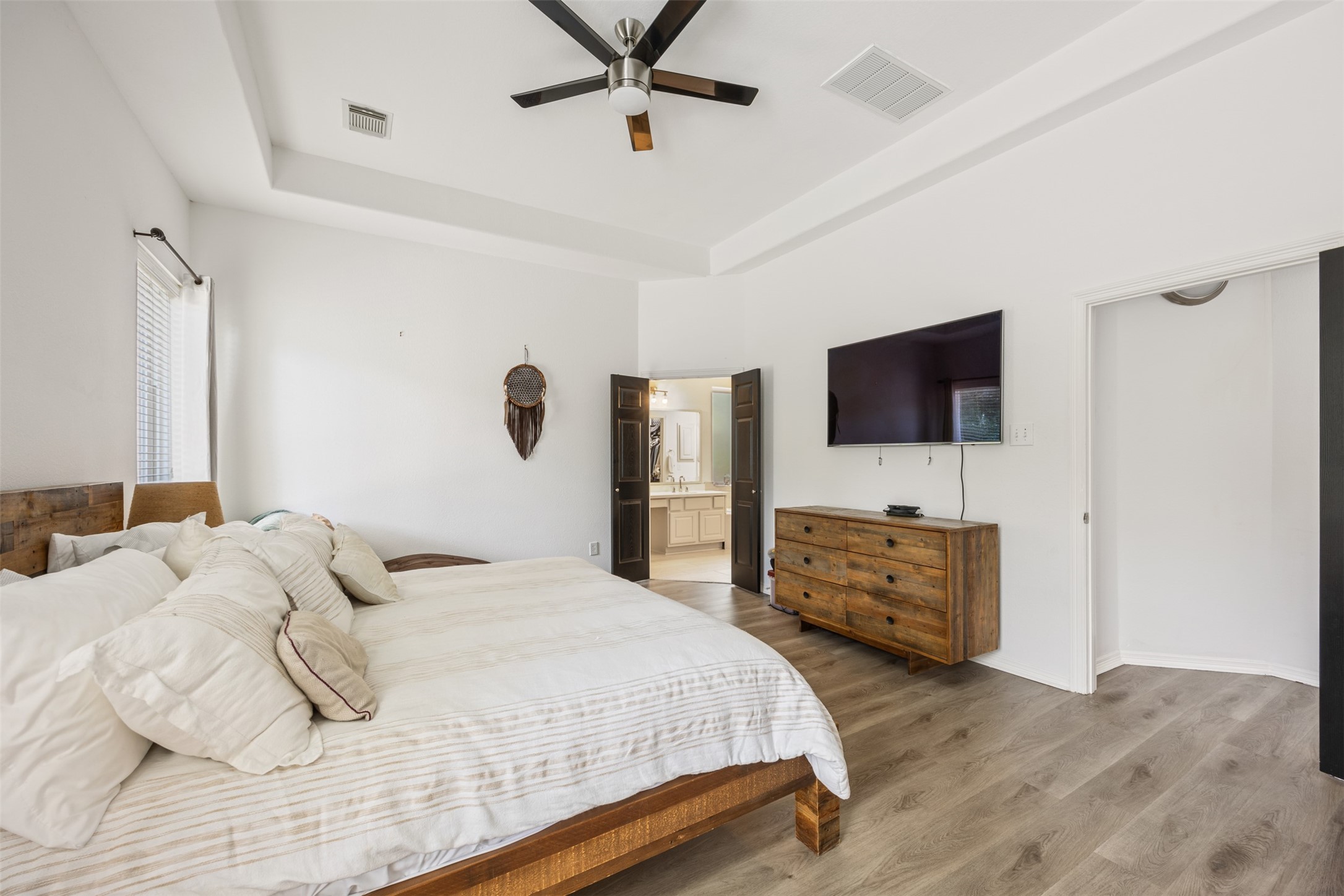 58 South Longsford Circle Spring, TX 77382 - Photo 37 of 50 a bedroom with a bed and a flat screen tv