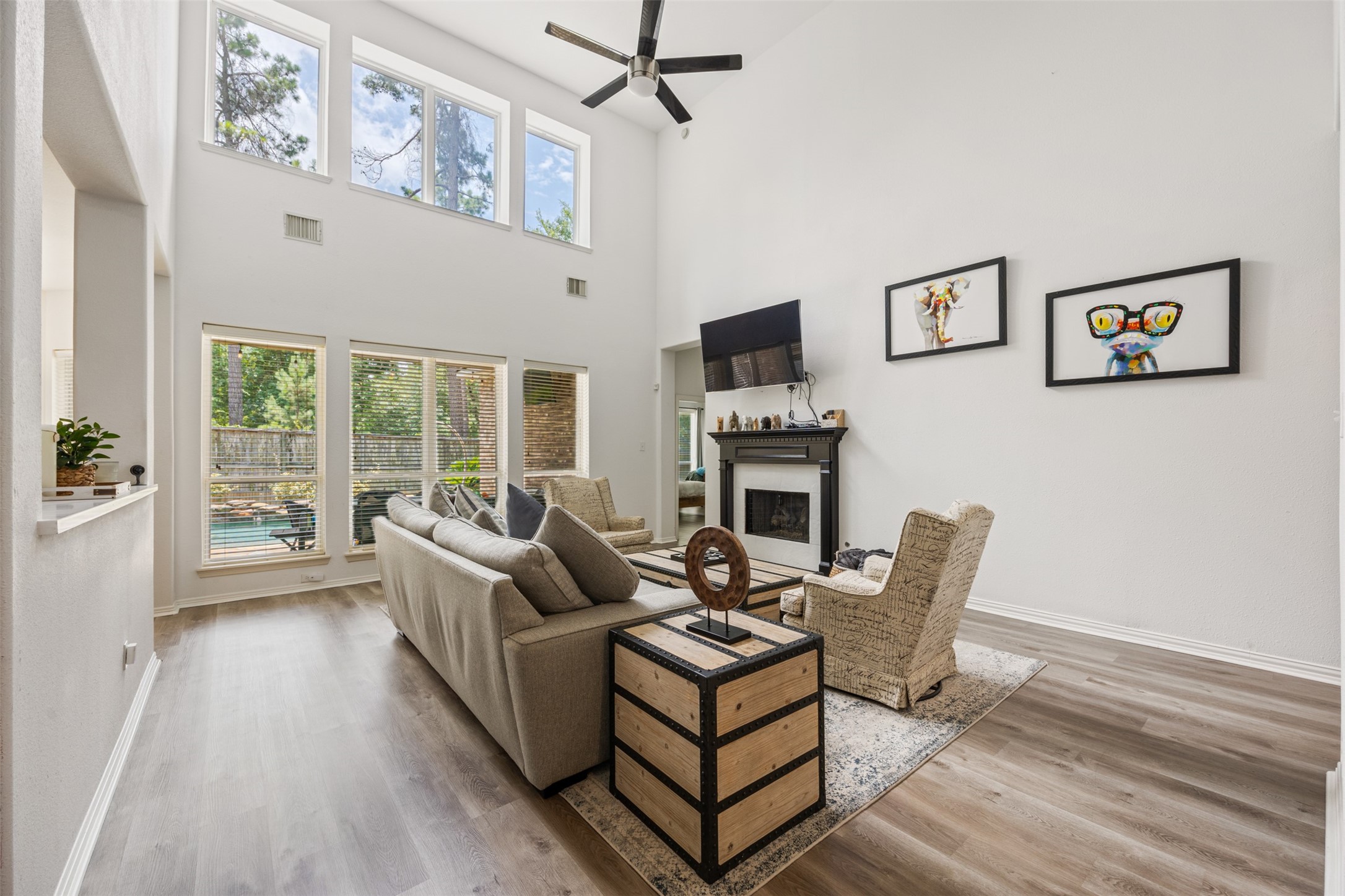58 South Longsford Circle Spring, TX 77382 - Photo 40 of 50 a living room with furniture a flat screen tv and a fireplace