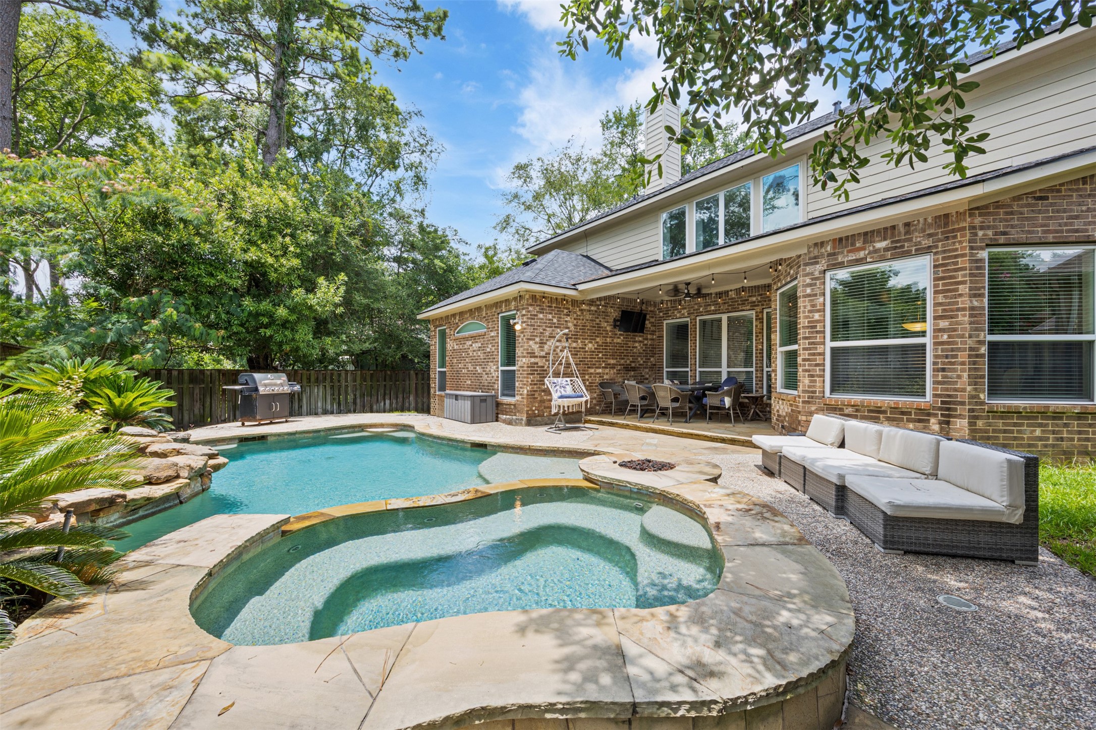 58 South Longsford Circle Spring, TX 77382 - Photo 5 of 50 a view of a house with swimming pool and sitting area