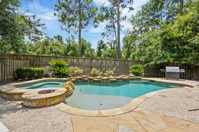 a view of a swimming pool with a patio