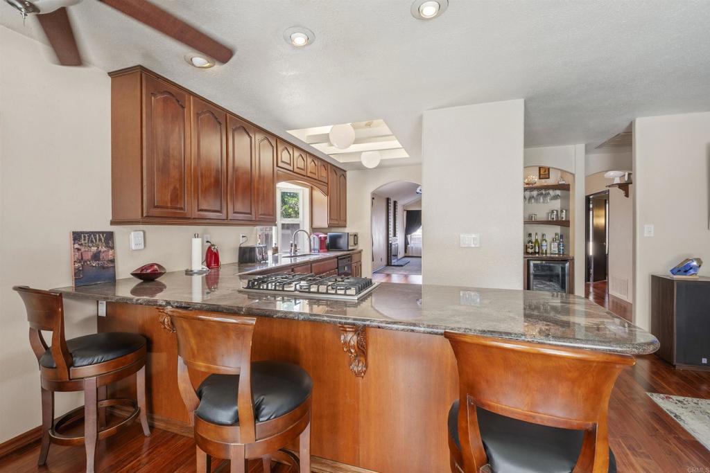 9715 Kenesaw Court Santee, CA 92071 - Photo 14 of 36 a kitchen with stainless steel appliances granite countertop a sink and cabinets