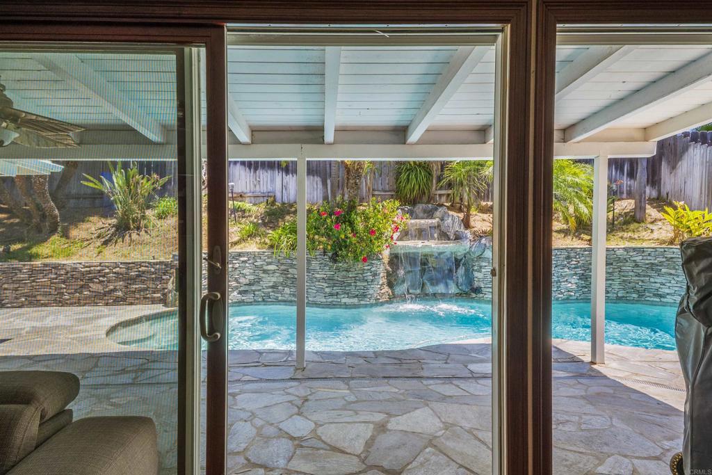 9715 Kenesaw Court Santee, CA 92071 - Photo 18 of 36 a view of a porch with a floor to ceiling window and wooden floor