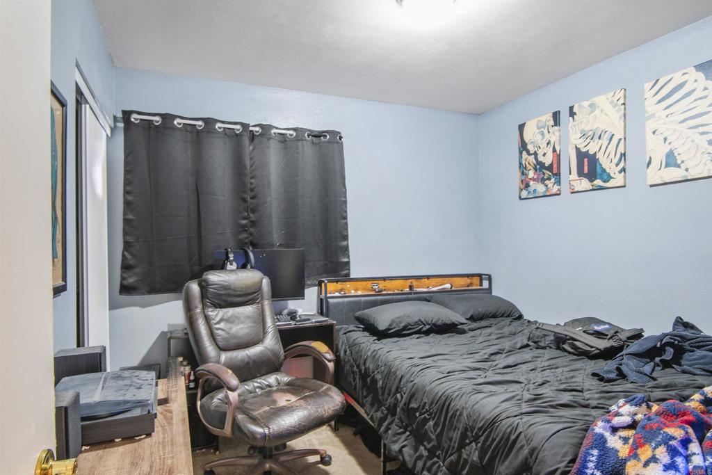 9715 Kenesaw Court Santee, CA 92071 - Photo 23 of 36 a bedroom with a bed and a painting on the wall