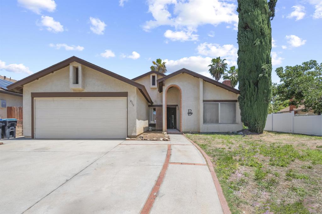 9715 Kenesaw Court Santee, CA 92071 - Photo 36 of 36 a front view of a house with a yard and garage