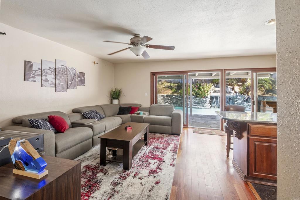 9715 Kenesaw Court Santee, CA 92071 - Photo 6 of 36 a living room with furniture and a large window