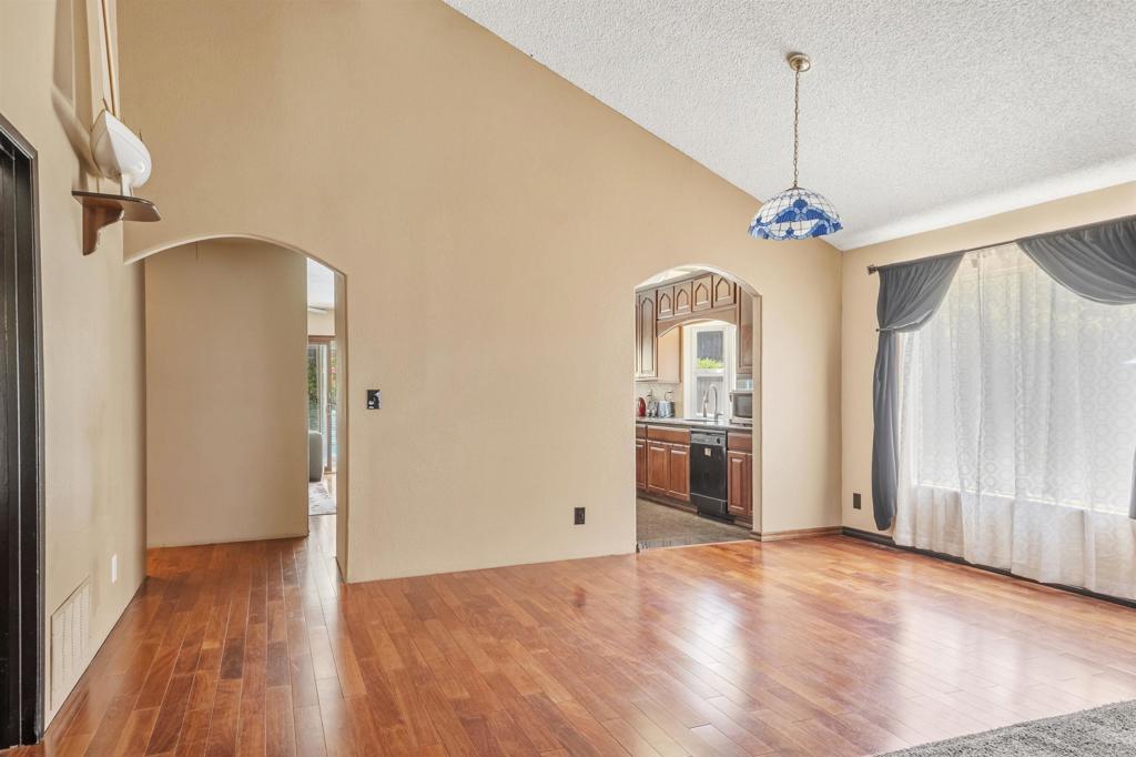 9715 Kenesaw Court Santee, CA 92071 - Photo 10 of 36 a view of empty room with wooden floor and fan