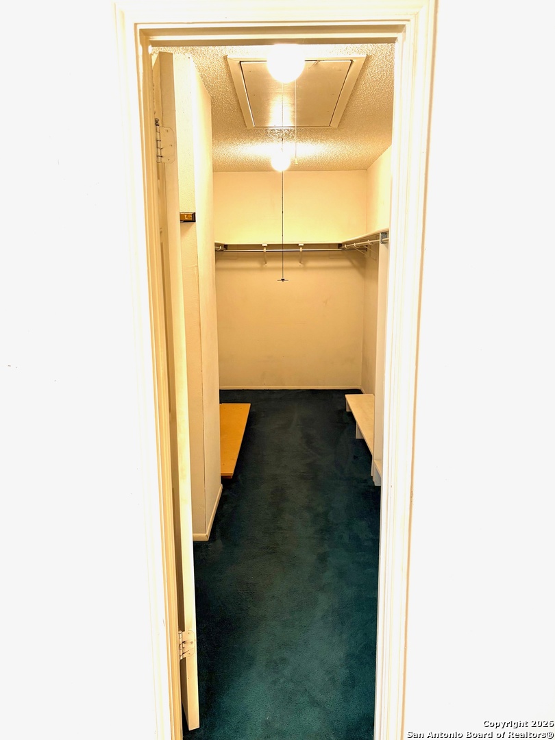 7501 Avery Road Live Oak, TX 78233 - Photo 11 of 32 a view of walk in closet with a window