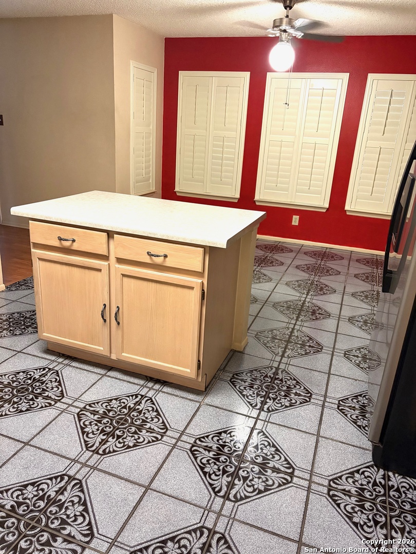 7501 Avery Road Live Oak, TX 78233 - Photo 23 of 32 a bathroom with a mirror and a sink