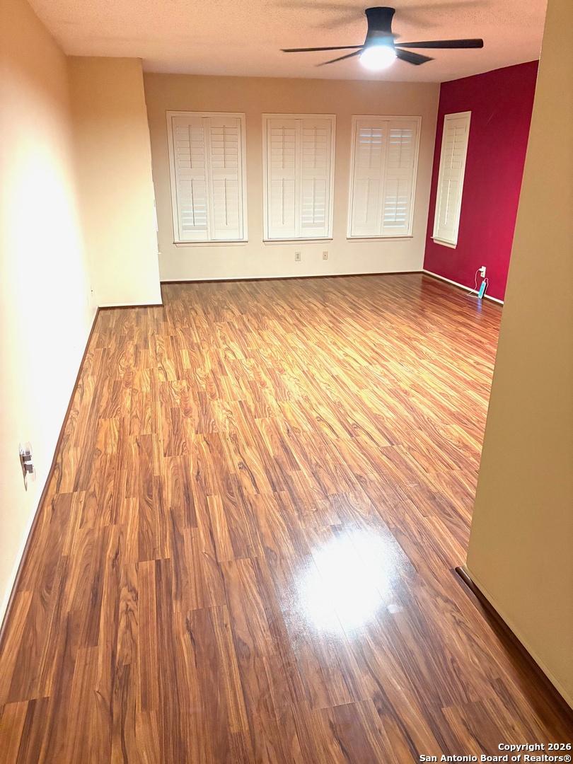 7501 Avery Road Live Oak, TX 78233 - Photo 6 of 32 a view of empty room with wooden floor and fan
