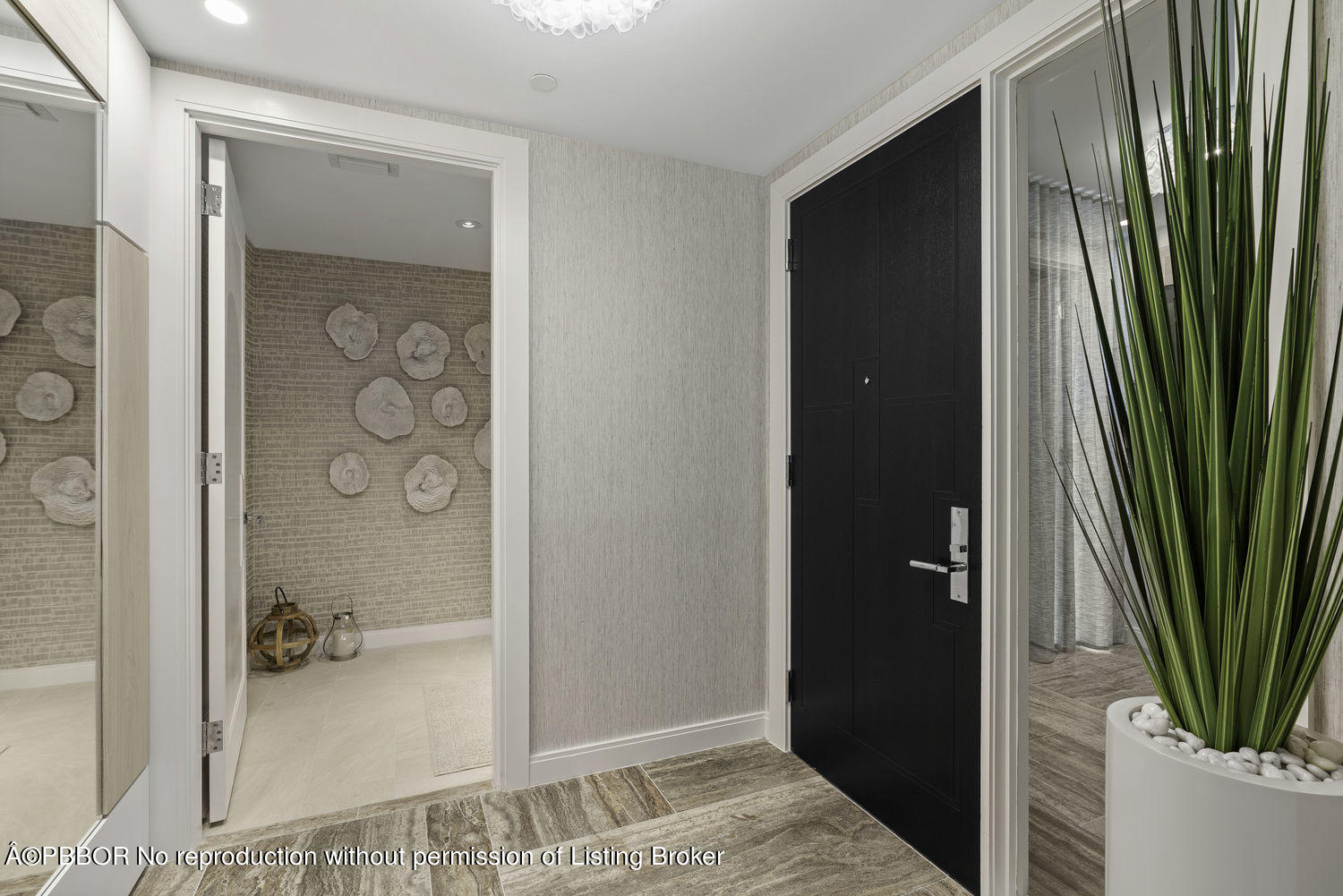 a bathroom with a shower and a glass door