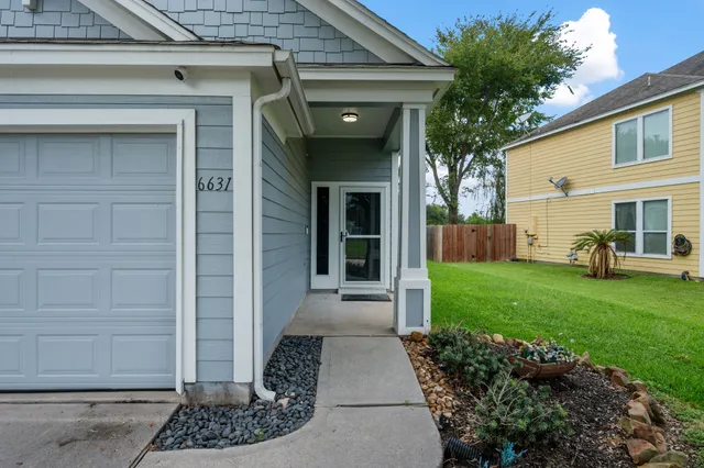 a view of a house with a small garden