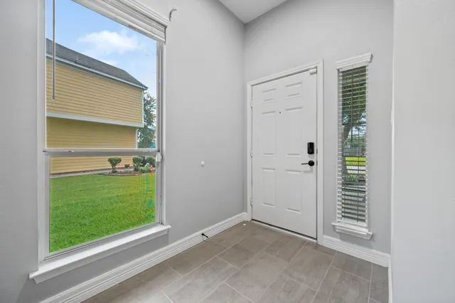a view of an empty room with a window