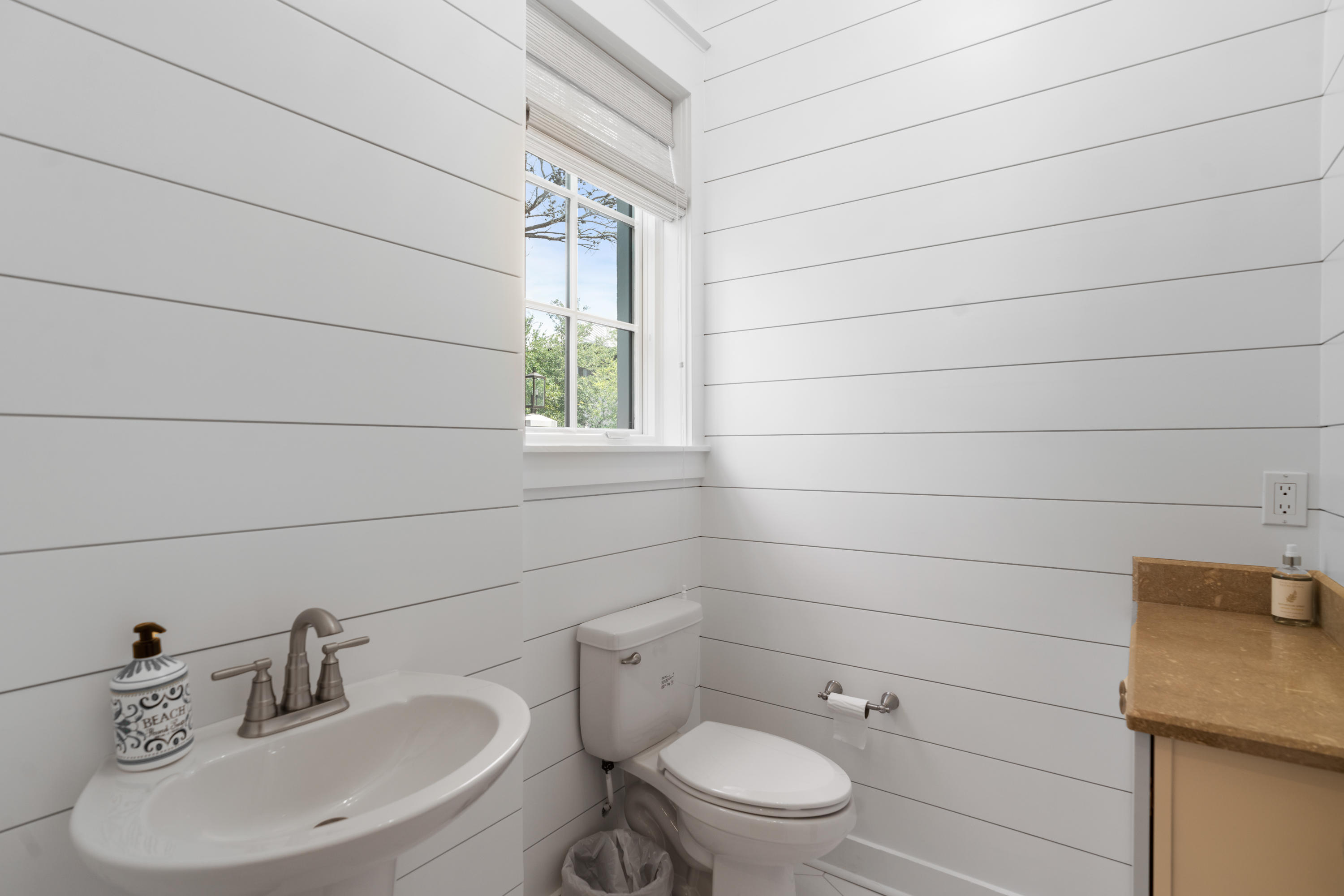 98 Pine Crest Circle Inlet Beach, FL 32461 - Photo 11 of 66 a bathroom with a toilet a sink and mirror