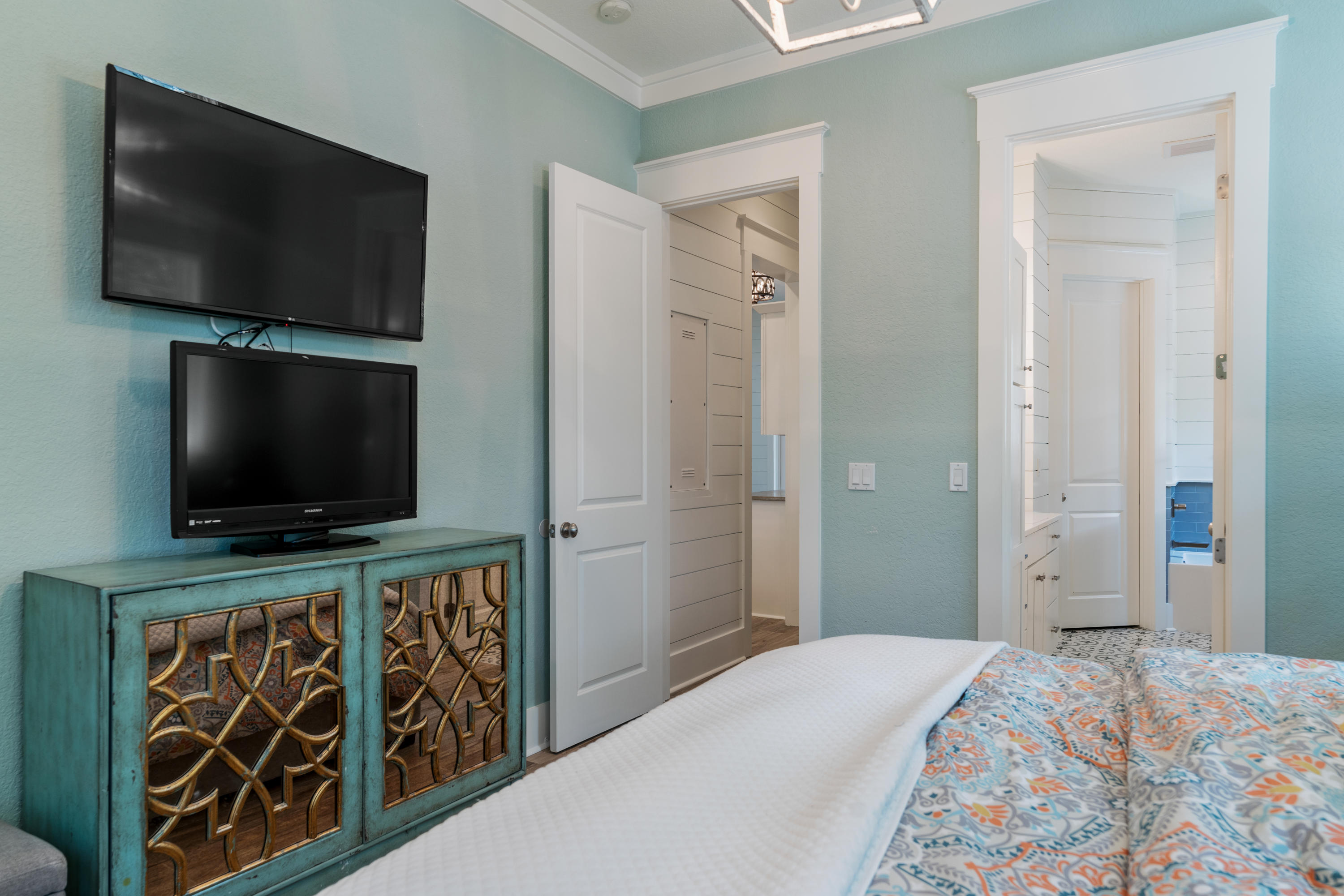 98 Pine Crest Circle Inlet Beach, FL 32461 - Photo 15 of 66 a hotel room with flat screen tv and a bed