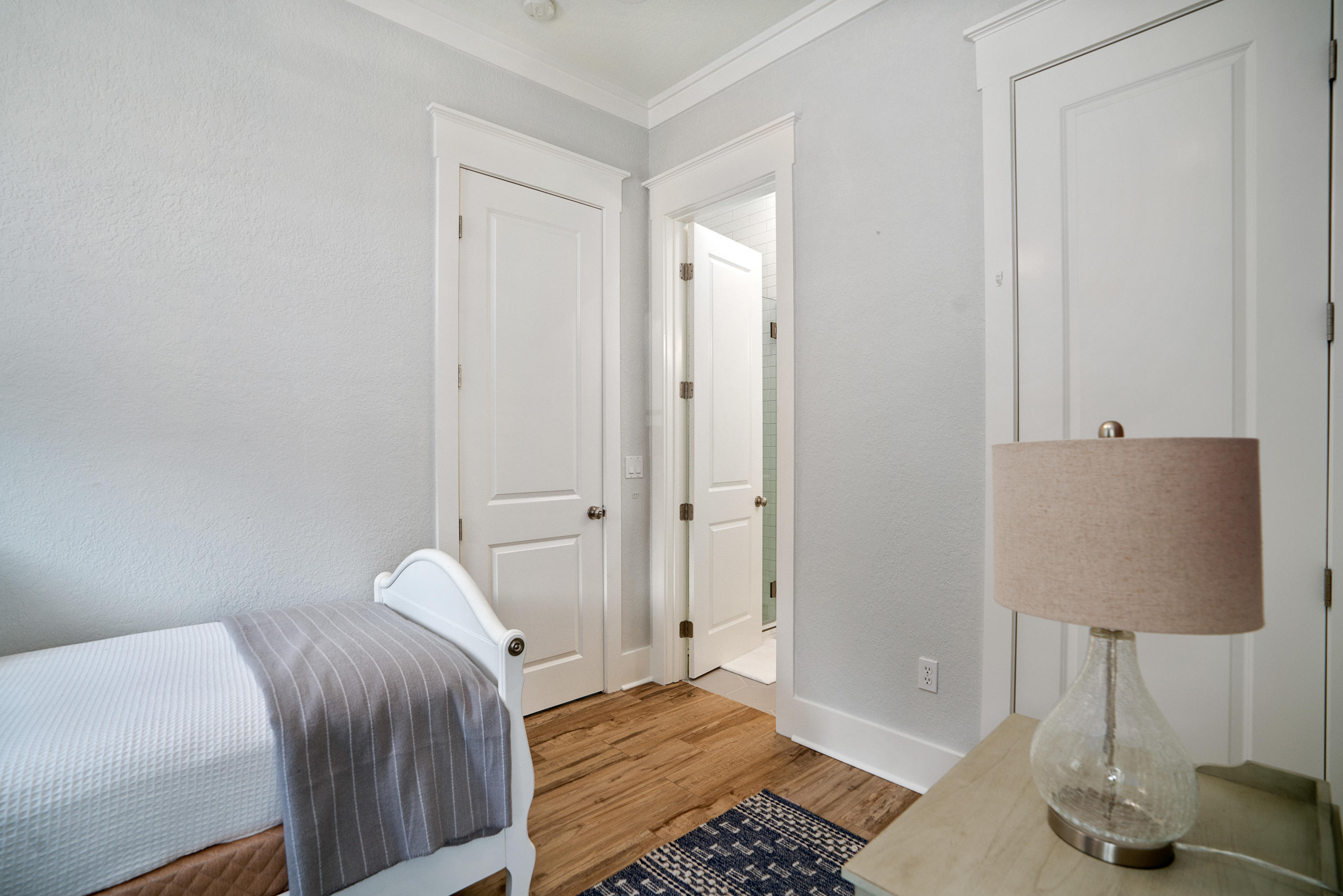 98 Pine Crest Circle Inlet Beach, FL 32461 - Photo 19 of 66 a bedroom with a bed and a lamp