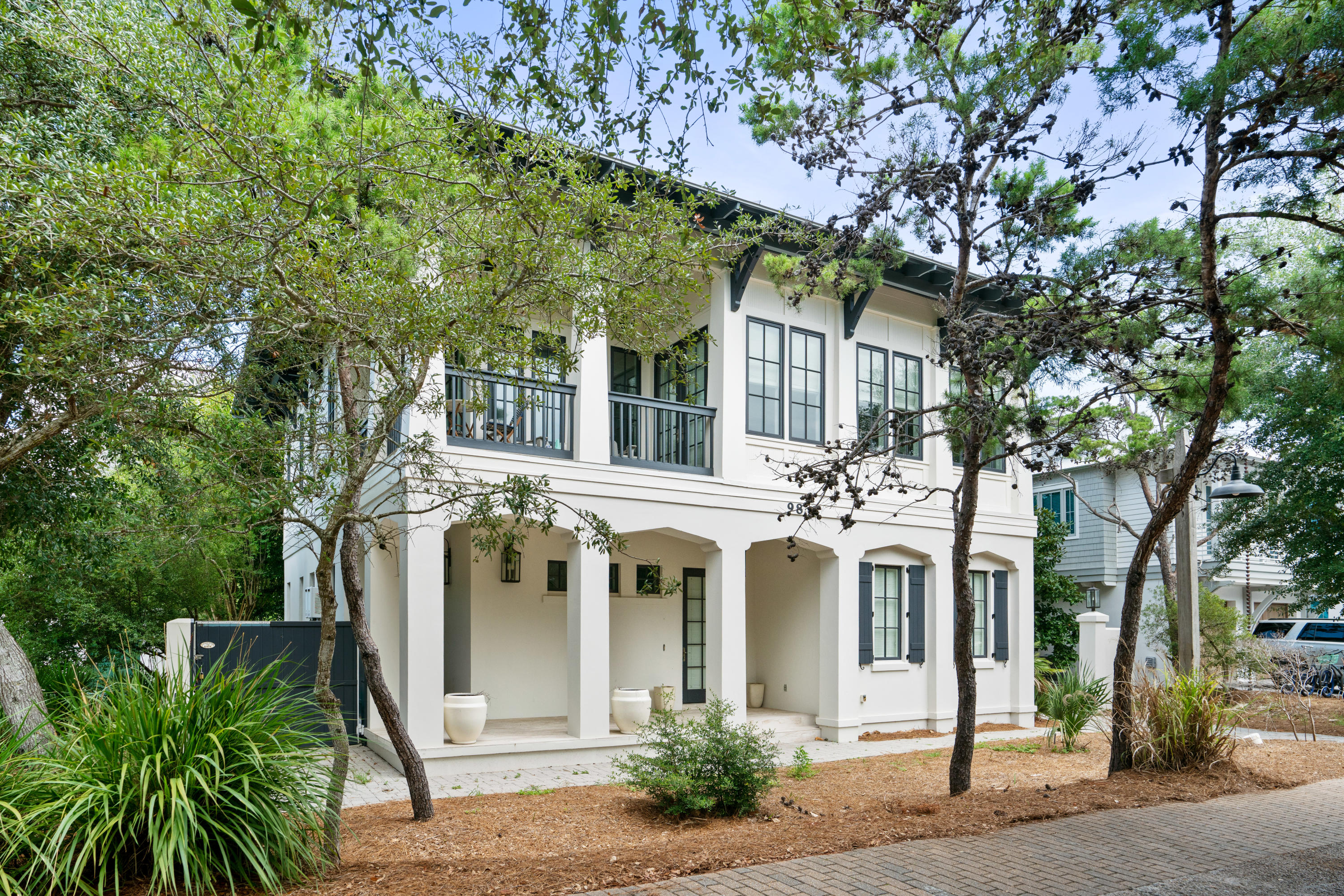 98 Pine Crest Circle Inlet Beach, FL 32461 - Photo 2 of 66 a front view of a house with a garden