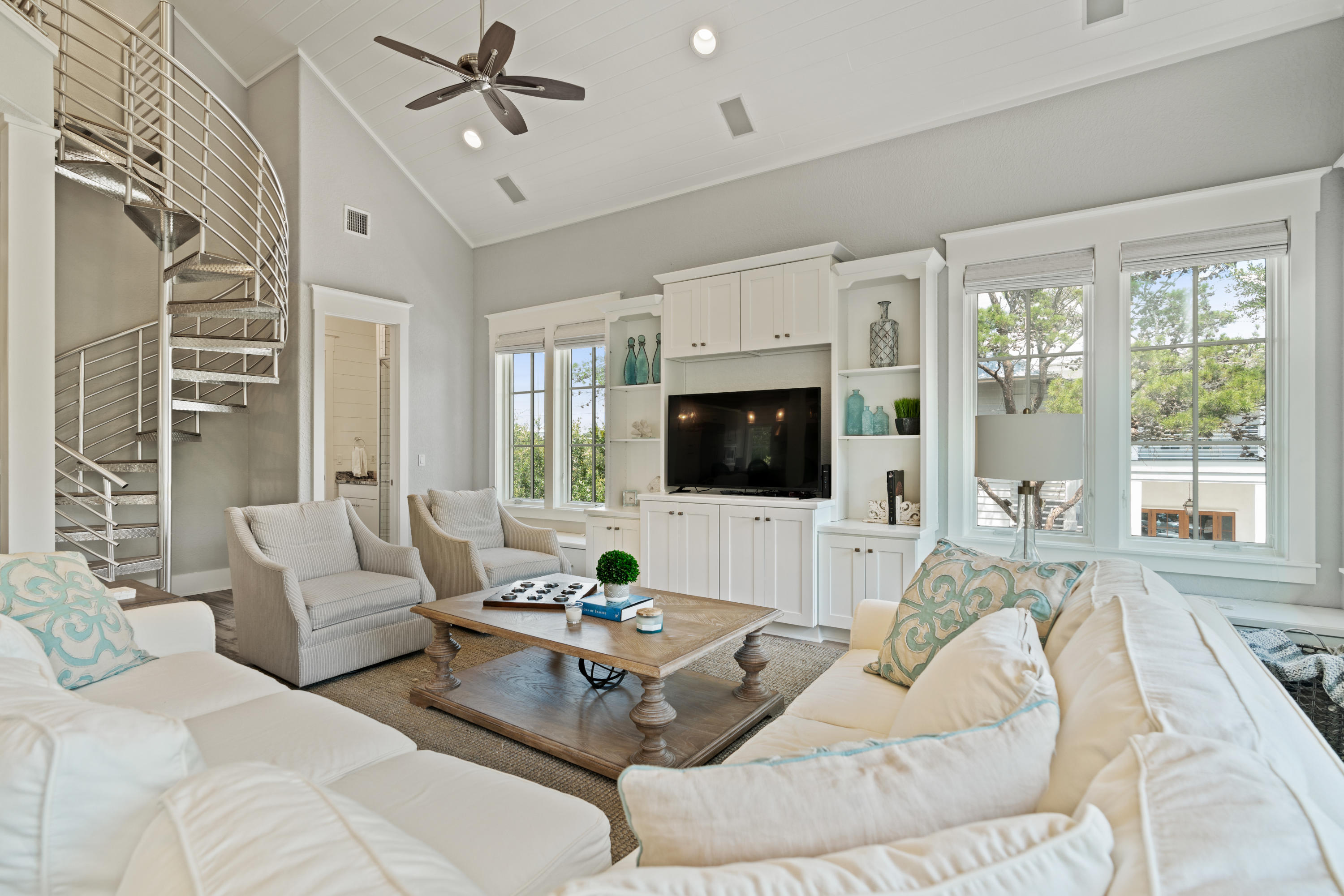 98 Pine Crest Circle Inlet Beach, FL 32461 - Photo 25 of 66 a living room with furniture flat screen tv and a large window