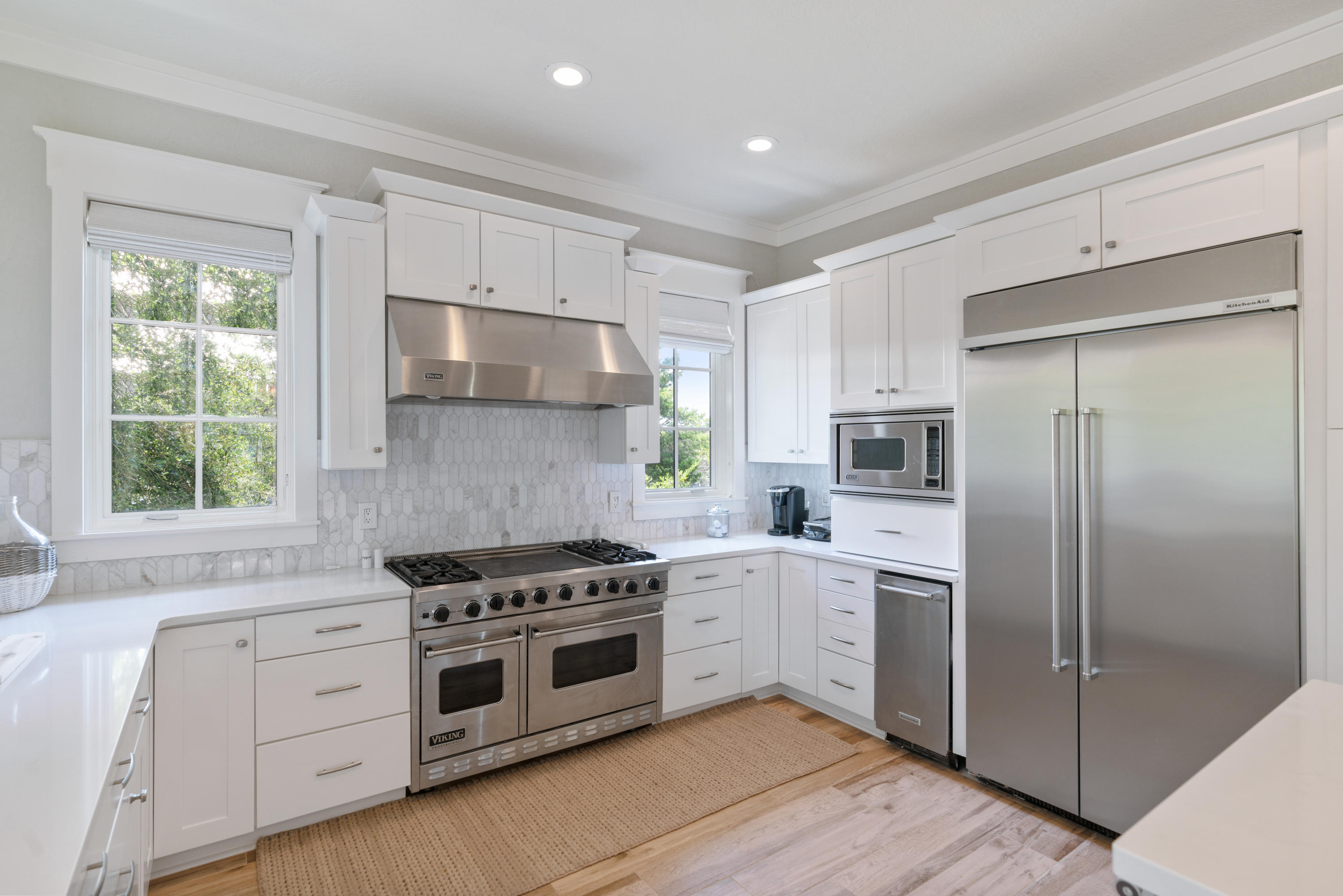 98 Pine Crest Circle Inlet Beach, FL 32461 - Photo 34 of 66 a kitchen with white cabinets stainless steel appliances and window