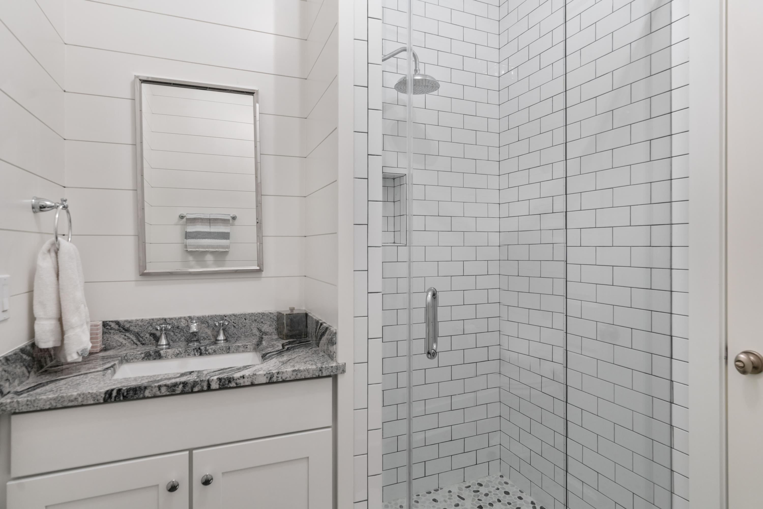 98 Pine Crest Circle Inlet Beach, FL 32461 - Photo 42 of 66 a bathroom with a granite countertop sink and mirror