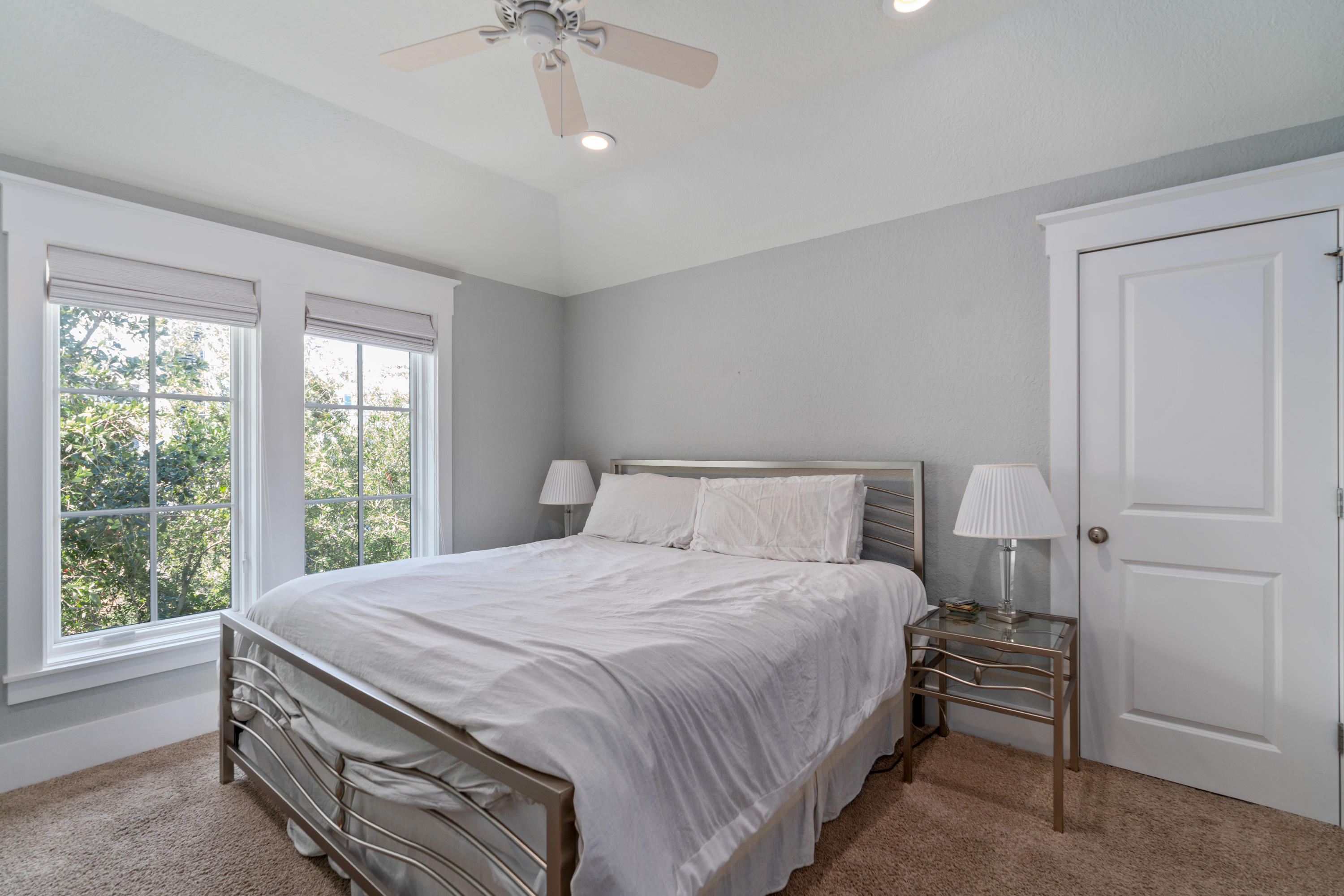 98 Pine Crest Circle Inlet Beach, FL 32461 - Photo 45 of 66 a bedroom with a bed and a chandelier
